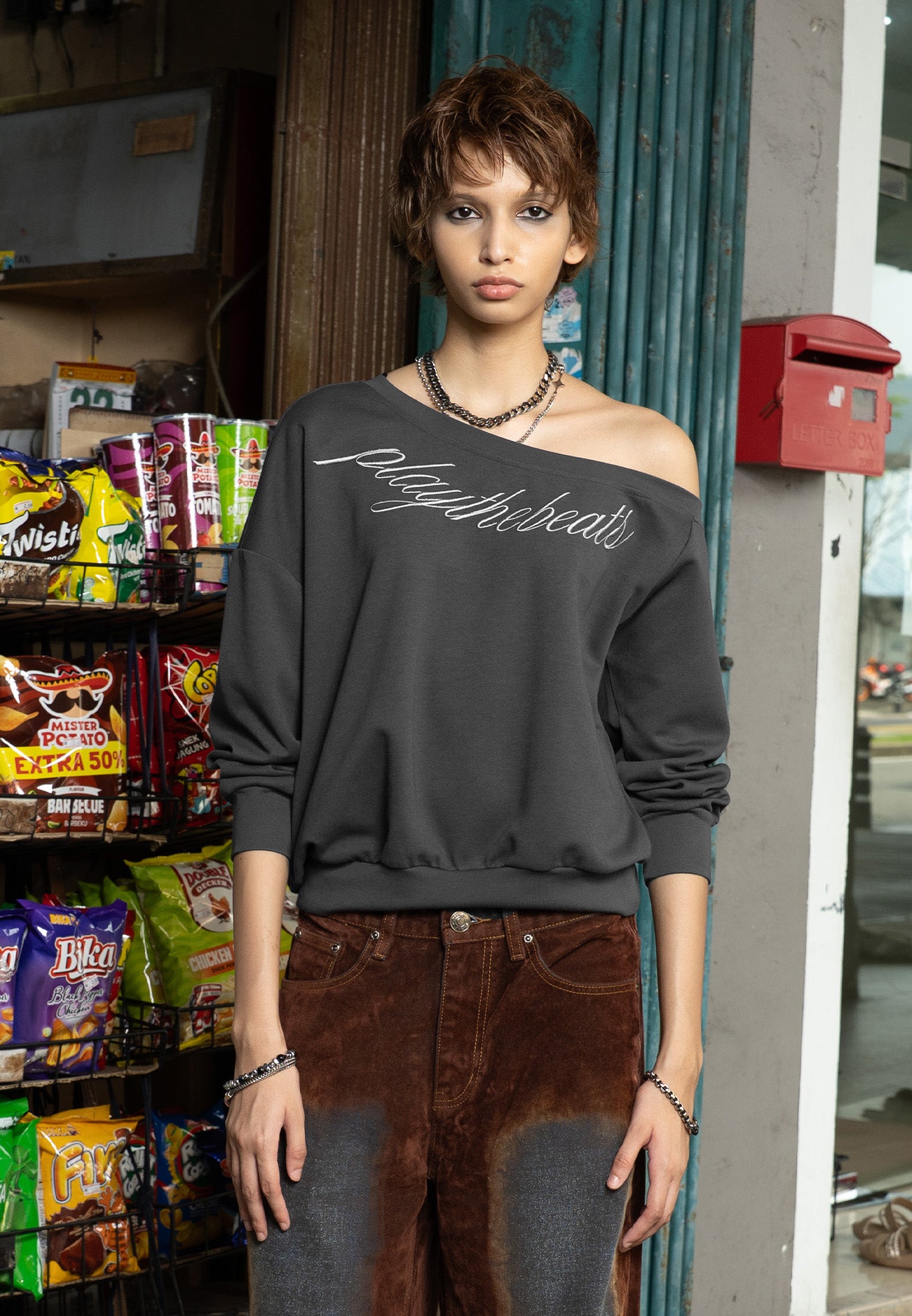 DRUM S. Women Asymmetrical Slogan Embroidery Jumper- Dark Grey