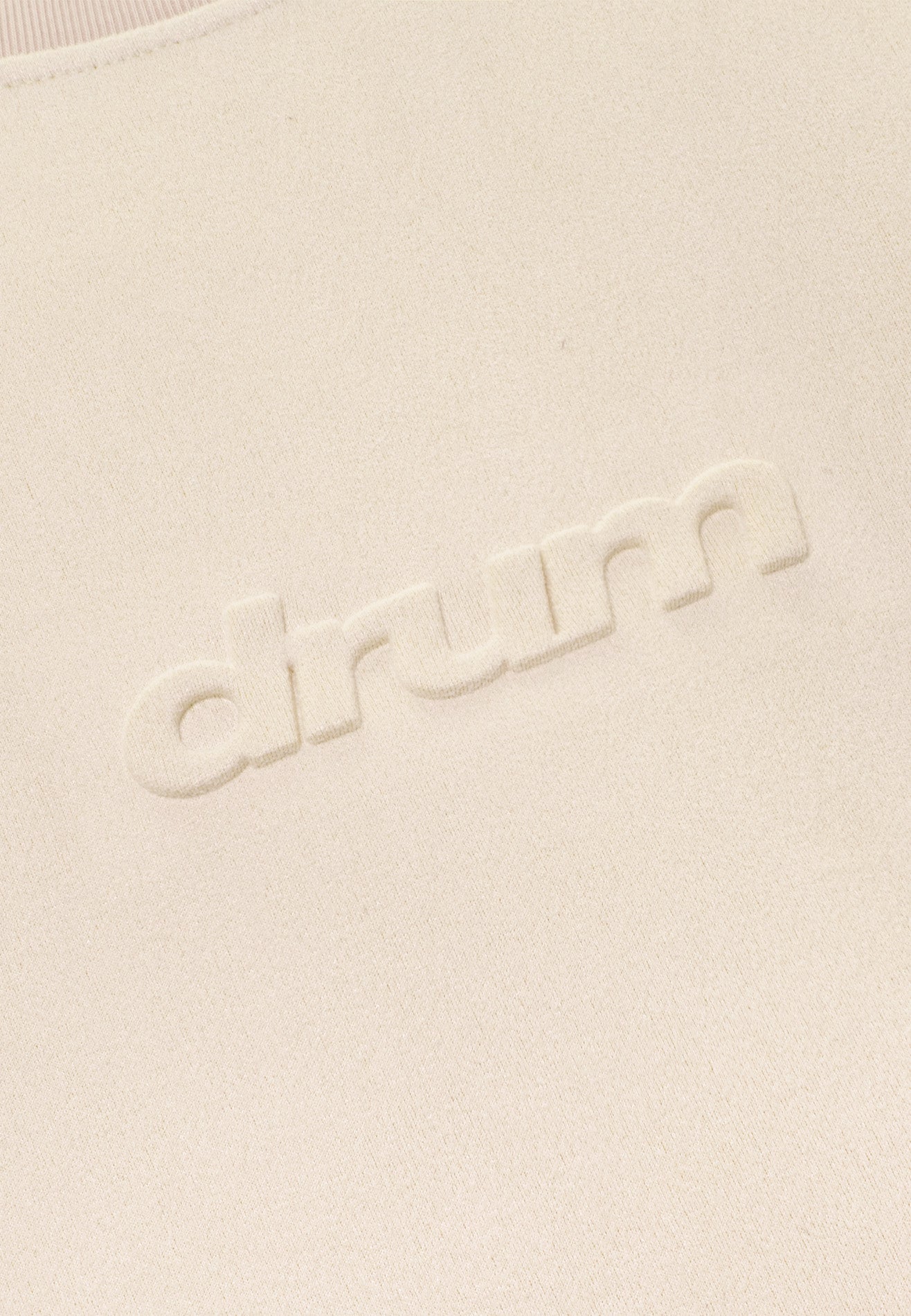DRUM E. Logo Embossed Velvety Oversized Tee- Beige