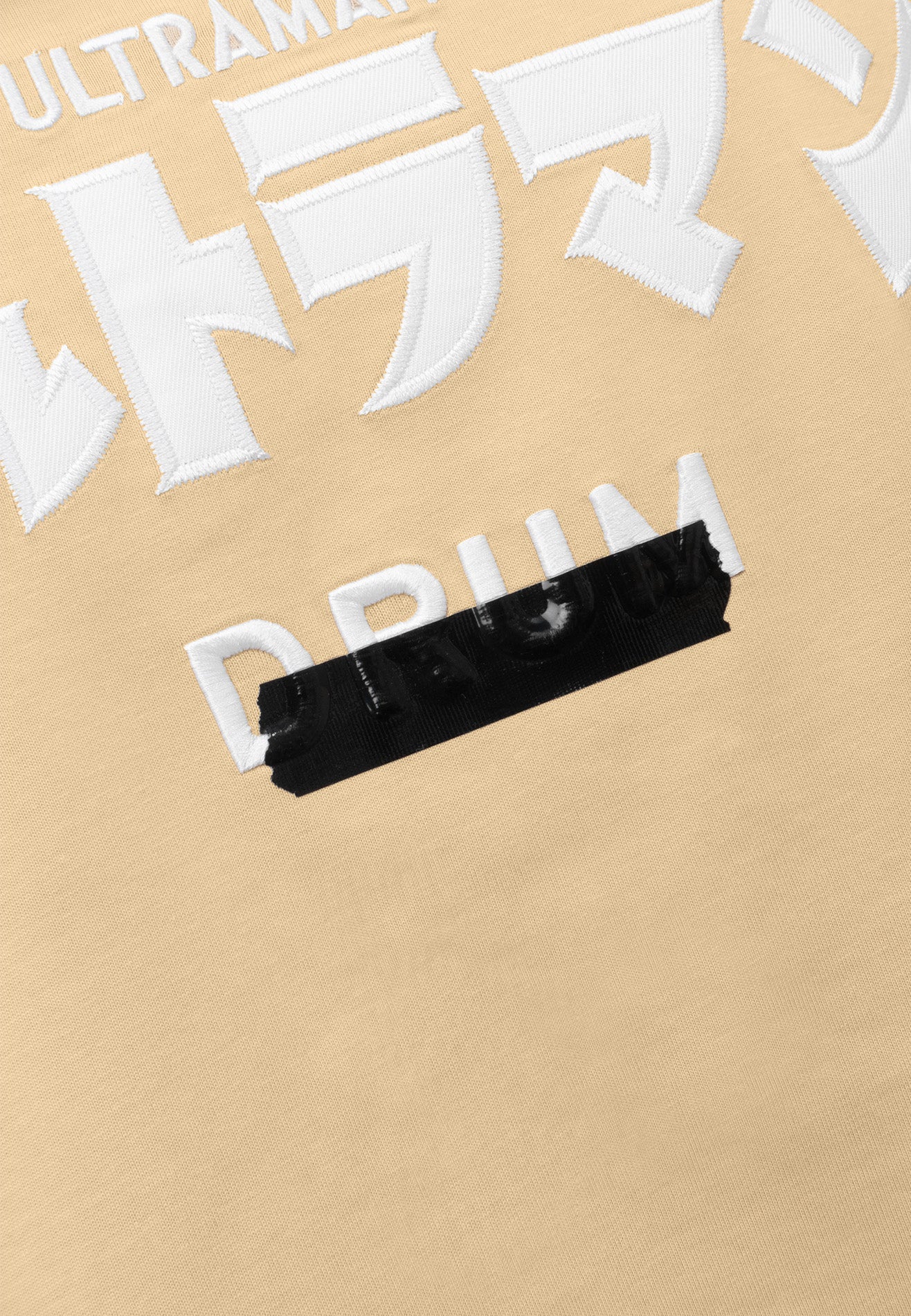 DRUM | ULTRAMAN Silicon Tape Details Oversized Tee- Light Khaki