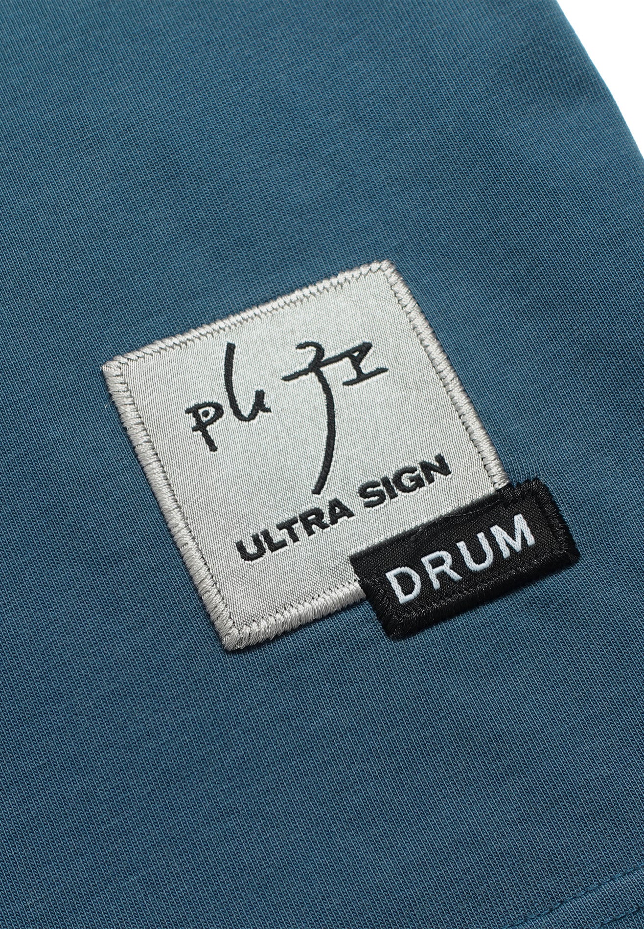 DRUM | ULTRAMAN Hibiscus Embroidery Stoned Washed Oversized Tee- Blue